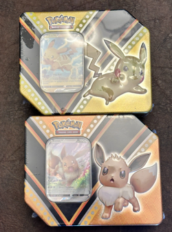 2X V Powers Tin Pikachu/Eevee Factory Sealed SKU: 210-80739 Free Shipping - Image 1