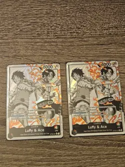 TWO Luffy & Ace Leader Alternate Art cards (ST30). Includes both cards - Image 1