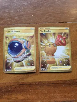 Pokemon Lot Of 2 Gold Trainers Full Face Guard 231/203 And Toy Catcher 233/203 - Image 1