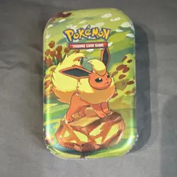 Pokemon TCG Flareon Mini Tin, 2 Booster Packs Prismatic Evolutions - Seales - Image 1