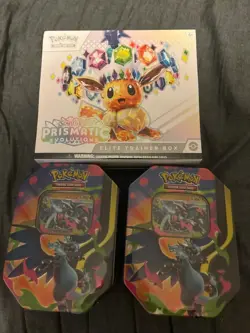 SEALED BUNDLE - Pokemon TCG Prismatic Evolutions ETB + 2 Charizard X EX Tins - Image 1
