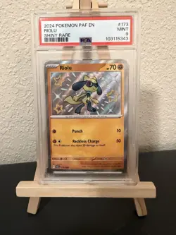 Graded PSA 9 2024 Pokemon PAF EN Riolu Shiny Rare #173 - Image 1