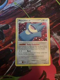 Munchlax LV.13 69/111 – Rising Rivals Pokemon Card - Image 1