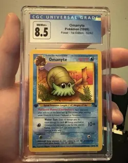 Omanyte Fossil 52/62 1st Edition Regular Card Graded - Image 1