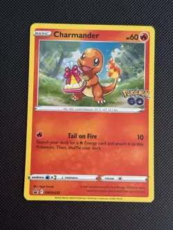Pokemon TCG Charmander SWSH232 Black Star Promo Pokemon GO - Image 1