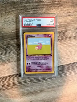 1999 POKEMON FOSSIL 1ST EDITION #55 SLOWPOKE PSA 9 - Image 1