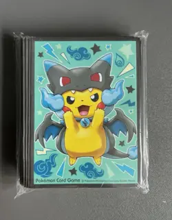 Pokemon Center Poncho-Wearing Pikachu Mega Charizard X Sleeves Sealed - Image 1