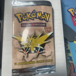 EMPTY Fossil Unlimited Pokemon Booster Pack Wrapper (Zapdos Art) - Image 1