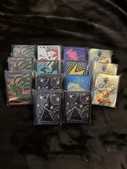 Lot of 14 Assorted Pokemon Sealed ETB Card Sleeves - Image 1