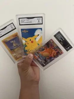 GMA Pokemon Graded Card Collection. Lot Of 3. Charizard Cubone 1999 Pikachu Tops - Image 1
