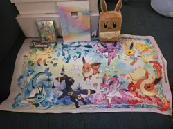 Pokemon Prismatic Evolutions Eevee Deck Box Sleeves, Card Frame, And Play Mat - Image 1