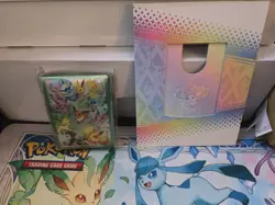 Pokemon Prismatic Evolutions Eevee Deck Box Sleeves, Card Frame, And Play Mat - Image 2