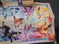 Pokemon Prismatic Evolutions Eevee Deck Box Sleeves, Card Frame, And Play Mat - Image 5
