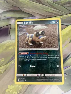 Pokemon TCG Unbroken Bonds 113/214 Sandile Reverse Holo NM - Image 1