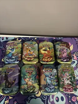 Pokemon Prismatic Evolutions Eeveelutions Mini Tin Full Set 8 Coins & Art - Image 1