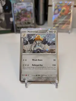 Pokemon TCG Stellar Crown Melmetal 104/142 Cosmos Holo Blister Exclusive - Image 1