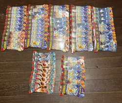 57 Pokemon Surging Sparks Factory Sealed Sleeved Packs & 7 Paradox Rift Packs - Image 2