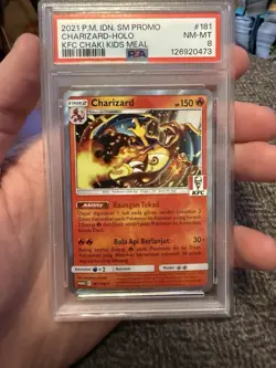 Pokemon Charizard 181/SM-P KFC Kentucky Fried Chicken Promo PSA 8 Indonesian - Image 1