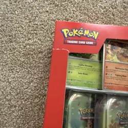 Pokemon TCG Prismatic Evolutions Costco 8 Mini-Tin Bundle w/ Promo Cards rip box - Image 2