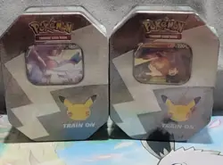 Pokemon 25th Anniversary Celebrations Tin Set: Lance's Charizard & Dark Sylveon - Image 1