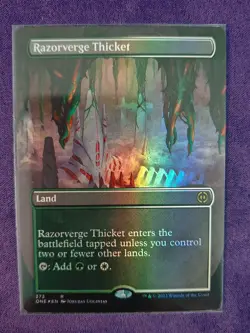 MTG Razorverge Thicket (Borderless) Phyrexia: All Will Be One Foil - Image 1