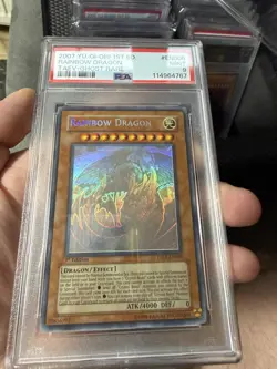 YuGiOh 2007 TAEV-EN006 Rainbow Dragon PSA 9 1st Edition Ghost Rare English - Image 1