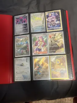 Pokemon cards in pokemon binder. - Image 1