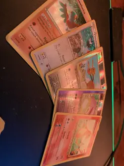 Pokemon 4 Card Holo Bundle W/ Charmamder And Other Cards In Spider-Man Tin! - Image 1