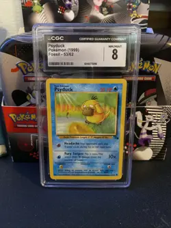 Psyduck 1999 Fossil - 1st Edition 53/62 Pokemon Card CGC 8 - Image 1