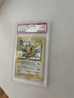 Pokemon PSA 9 1st Edition Jungle Jolteon Holo Rare (4/64) MINT - Image 1
