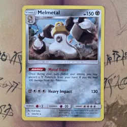 Melmetal 129/214 Unbroken Bonds Cosmos Holo NM Pokemon Card English - Image 1
