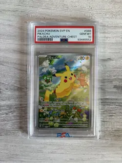 2024 POKEMON SVP EN-SV BLACK STAR PROMO PALDEA ADVENTURE CHEST PIKACHU PSA 10 - Image 1