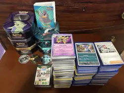 Bulk Pokemon cards. Holo cards. Code cards. Empty Tins, coins, And a Mini binder - Image 2