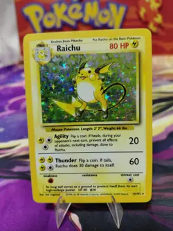 Pokemon TCG Base Set Raichu Holo Card 14/102 Unlimited Holo Rare LP/MP CONDITION - Image 1