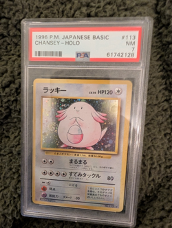 1996 POKEMON BASE SET JAPANESE #113 CHANSEY-HOLO PSA 7 - Image 1