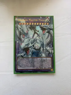 Yugioh BLGG-EN137 Dragon Master Magia Extended Art Ultra Rare Overframe - Image 1