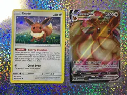 Pokemon TCG: Promo SWSH087 Eevee VMAX; Sun & Moon Cosmos Holo 101/149 Eevee - Image 1