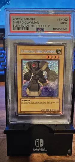 YUGIOH EHC2-EN002 ELEMENTAL HERO CLAYMAN SECRET RARE HOLO PSA 9 - Image 1