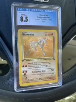 Pokemon TCG Hitmonlee 1st Edition Holo Rare Fossil 7/62 1999 CGC 8.5 - Image 1