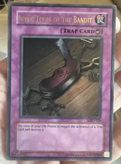 Konami Yu-Gi-Oh! Seven Tools of the Bandit MRD-129 Metal Raiders Trap ENG - Image 1