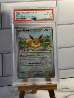 2025 POKEMON PRE EN-PRISMATIC EVOLUTIONS POKEMON DAY 2025 #074 EEVEE PSA 10 - Image 1