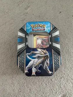Pokemon TCG Tin Filled With random Pokemon cards including holos - Image 1