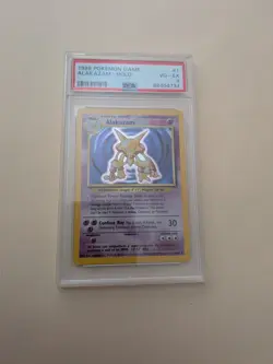 1999 Pokemon Alakazam Base Set Holo Rare #1/102 PSA 4 - Image 1