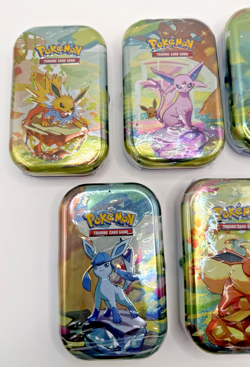 Pokemon TCG Prismatic Evolutions Mini Tin – Factory Sealed (Random Tin) - Image 2