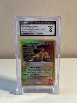 Team Magma’s Rhydon 22 CGC 8 Reverse Holo - ex Team Magma vs Team Aqua - Pokemon - Image 1