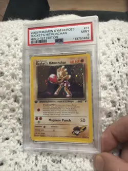 Pokemon 2000 Rocket's Hitmonchan 11 Holo 1st Edition Gym Heroes Swirl PSA 9 - Image 1