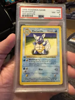 1999 POKEMON BASE SET 1ST EDITION #42 WARTORTLE PSA 8 - Image 1