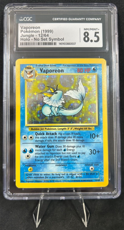 1999 POKEMON JUNGLE 12/64 VAPOREON HOLO - NO SET SYMBOL ERROR CGC 8.5 - Image 1