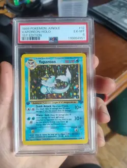 1999 POKEMON JUNGLE 1ST EDITION #12 VAPOREON - HOLO PSA 7 NM - Image 1