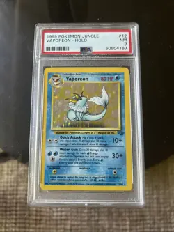 VAPOREON 12/64 HOLO NO SYMBOL ERROR POKEMON - 1999 WOTC Jungle - PSA 7 MINT - Image 1